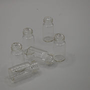 Group of clear 3 mL glass sample vials with flat bases