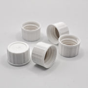 Group of white 18-400 closed-top polypropylene screw caps showing threaded interiors