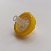 Single yellow 13 mm non-sterile nylon syringe filter viewed from the outlet side