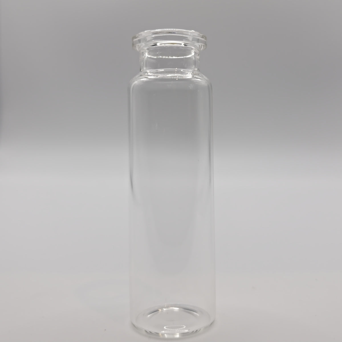 Clear 20 mL headspace vial with a flat bottom and ND20 crimp neck
