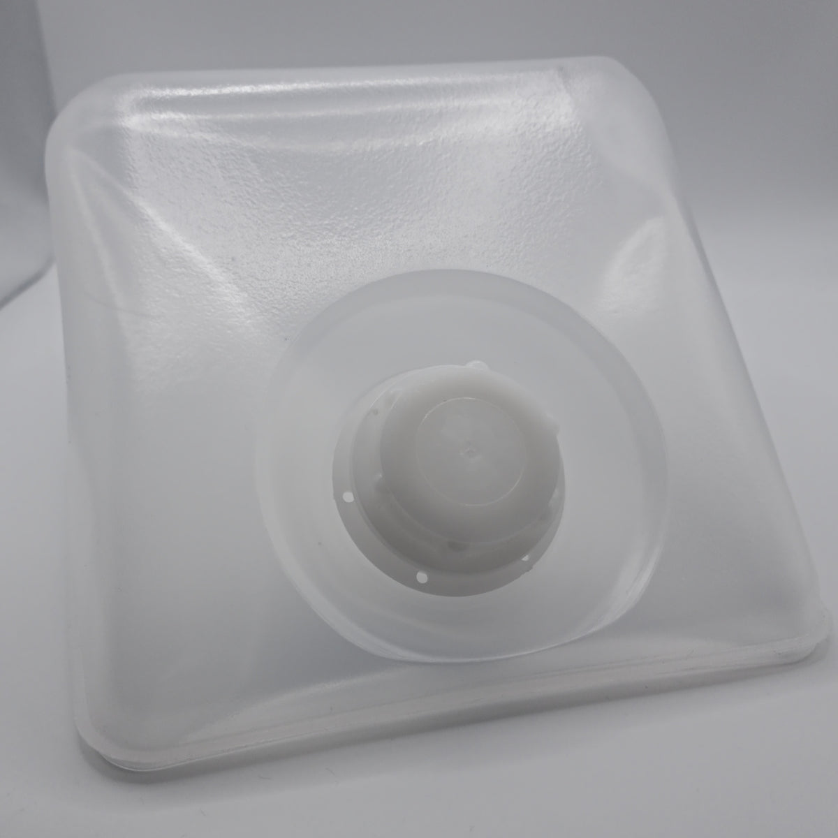 Front view of a natural translucent 5 L collapsible LDPE sampling cubitainer