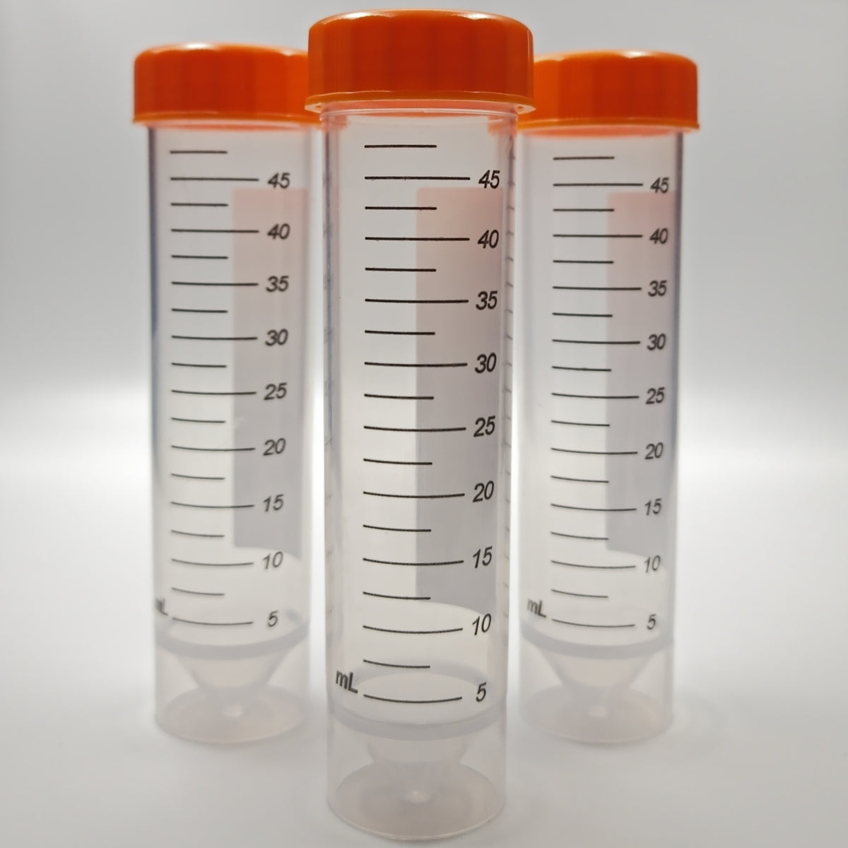 Three 50 mL sterile self-standing centrifuge tubes with orange screw caps
